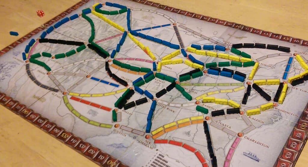 Ticket to Ride board with trains laid out across the country.