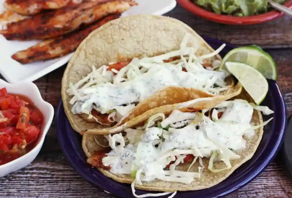 Fish tacos with cilantro lime crema.