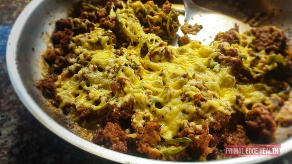 melted cheese over Ground Beef Philly Cheesesteak Skillet