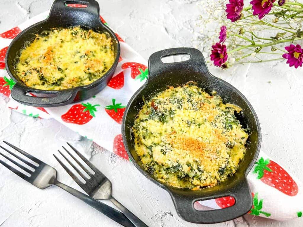 Chicken Florentine Bake in a black dish with a second in the background.