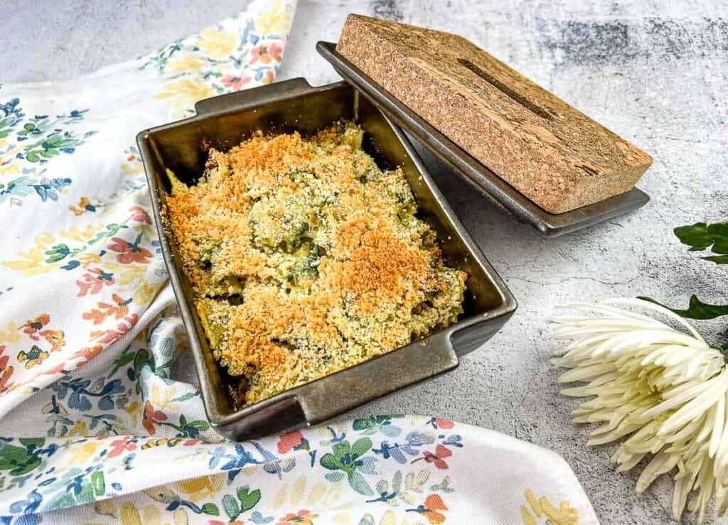 Chicken Florentine Pasta Bake in a casserole dish with a lid.