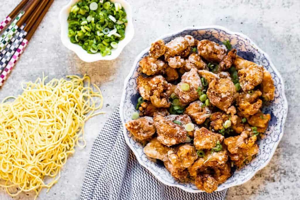 Overhead shot of karaage chicken with noodles on the side.