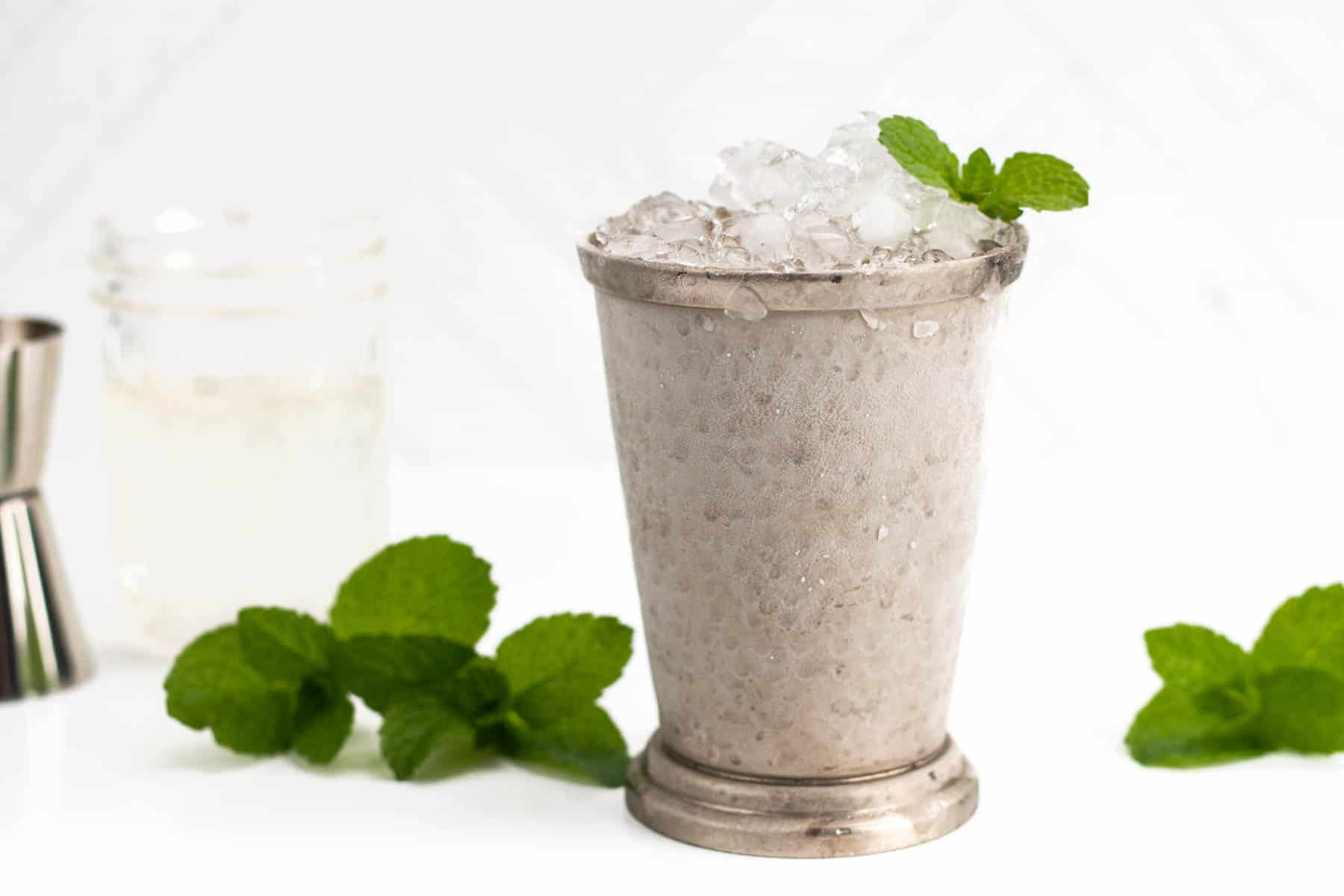 a mint julep with a bunch of fresh mint.