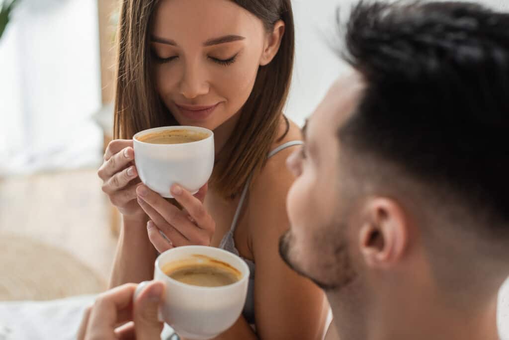 Man and woman drinking coffee.