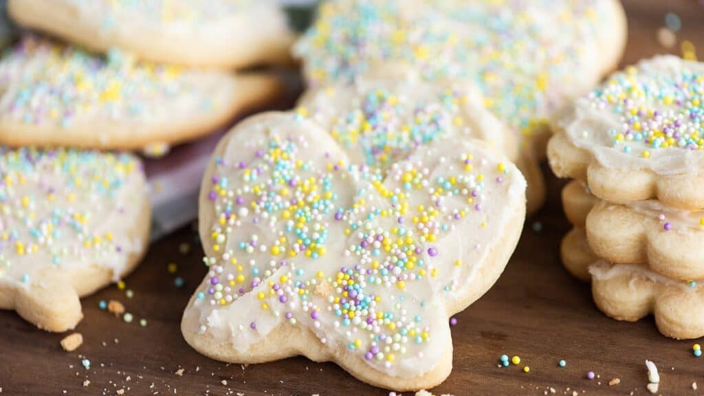 Homemade easter shaped cookies with icing and sprinkles.