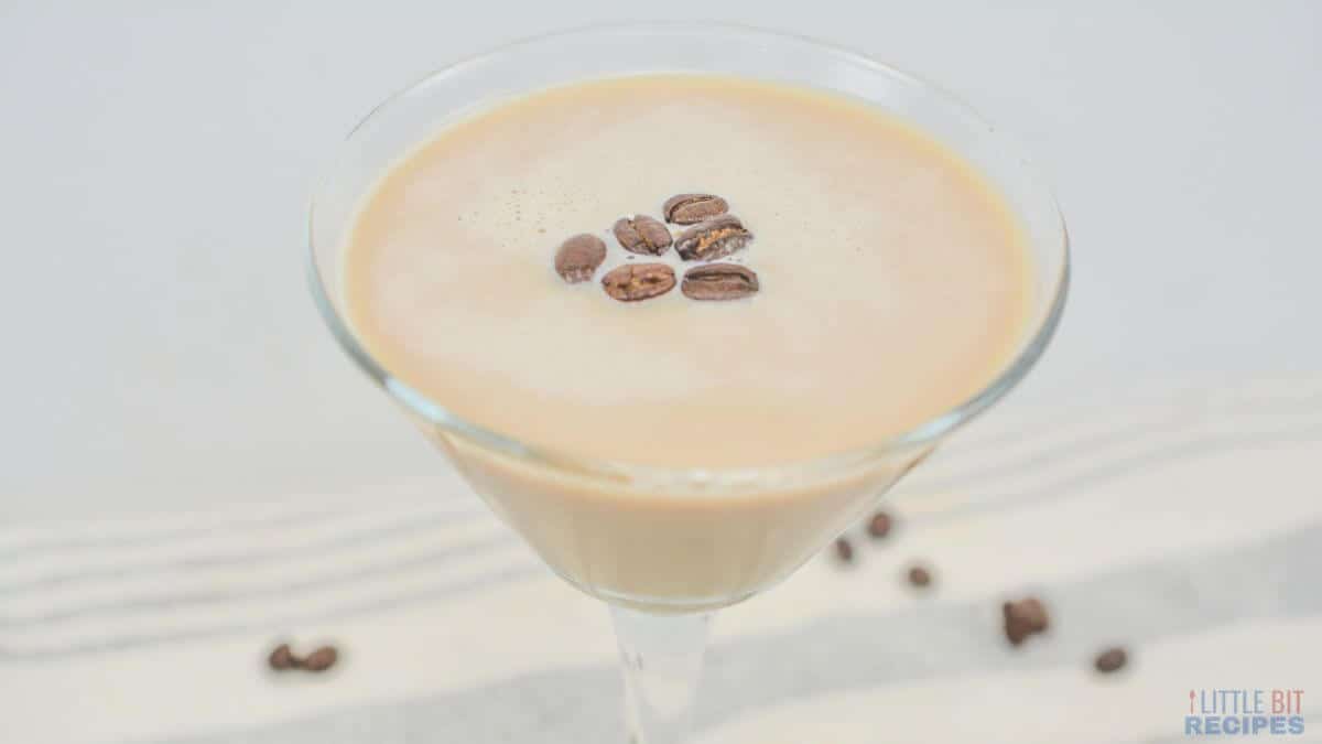 A refreshing glass of espresso martini with rich coffee beans.