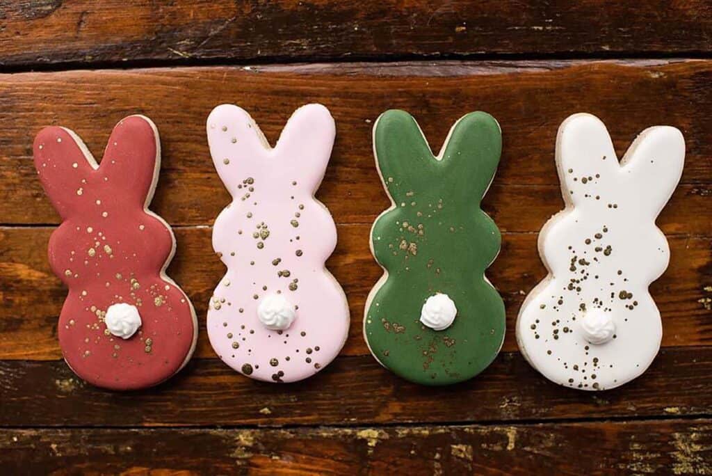 Overhead view of rabbit shaped cookies with icing on top.