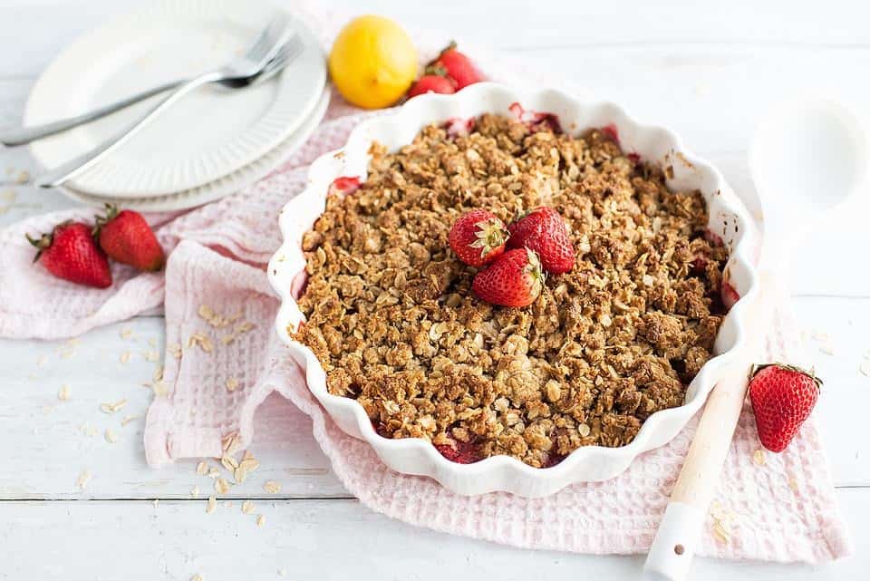 A homemade strawberry crisp in a baking dish.