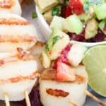 Grilled scallop skewers with plum tomatillo salsa.