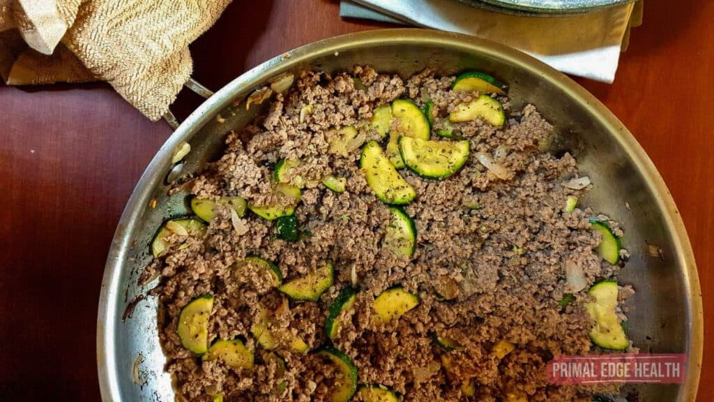 ground beef, onion, and zucchini in stainless skillet