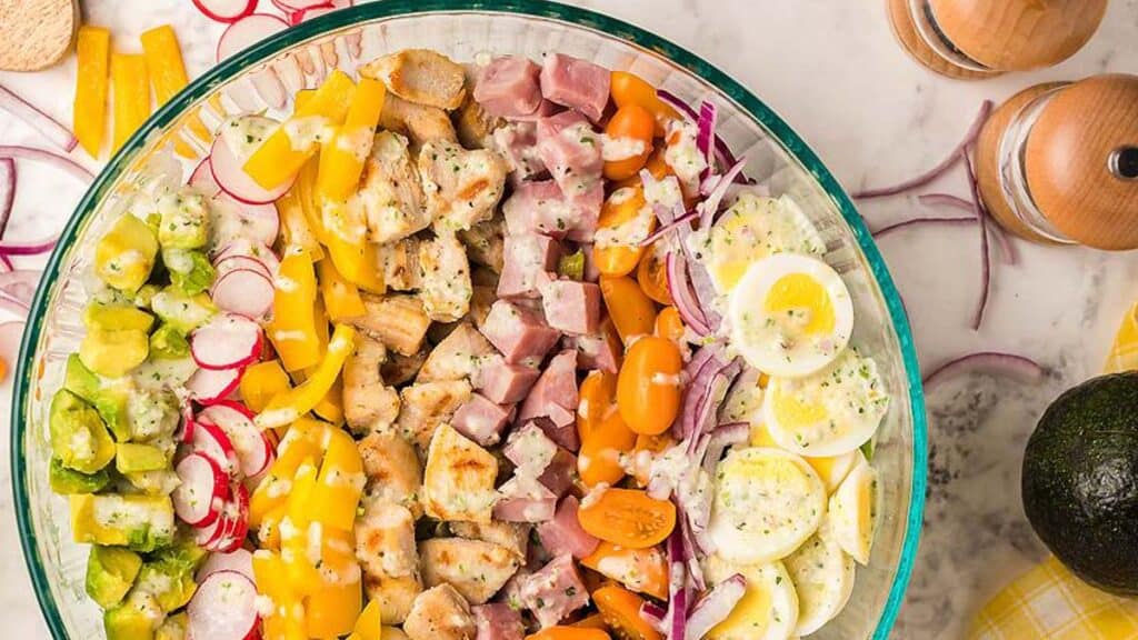 Overhead view of a cobb salad in a large bowl.