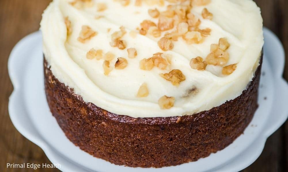 Keto Carrot Cake with frosting and nuts.