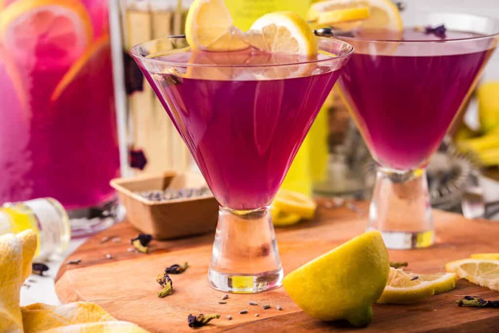 Purple cocktails in glasses on a table. 