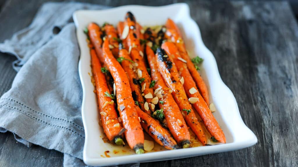 Maple glazed carrots on white dish.