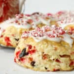 Chocolate and peppermint scones with icing and peppermint candies.