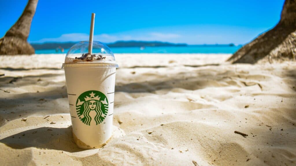 Starbucks Cup on a beach.
