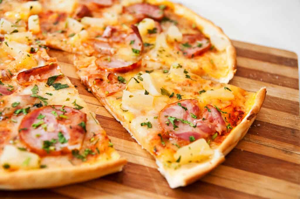 Pizza with pineapple and canadian bacon.