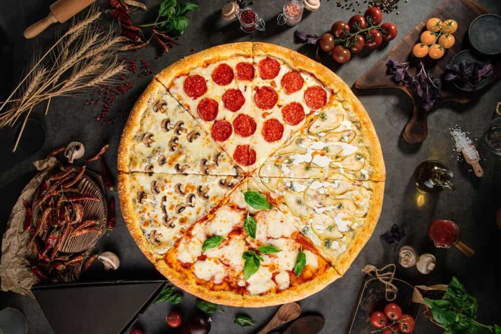 Pizza with sections with different toppings.