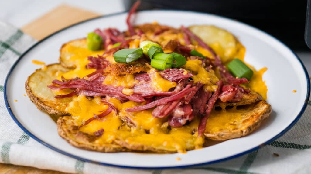 Irish potato nachos topped with corned beef, cheese and green onions.