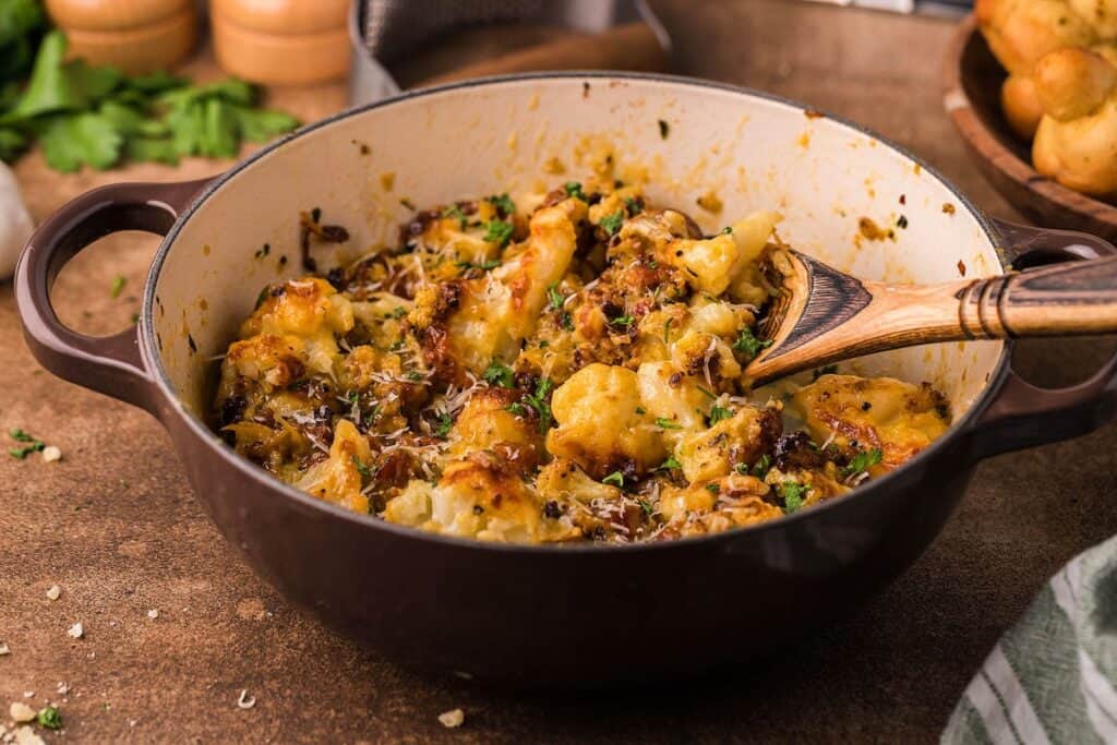 A dutch oven with a cauliflower pasta dish in it.