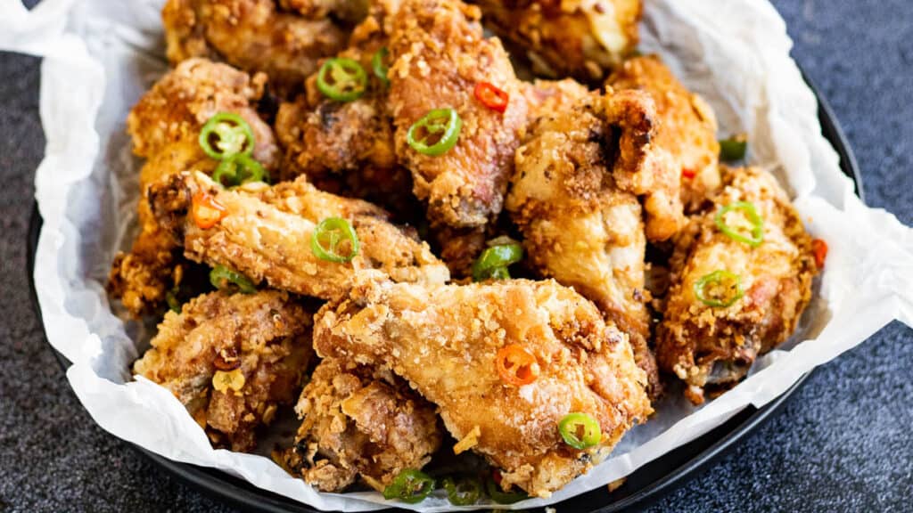 Low angle shot of a bowl of salt and pepper chicken.