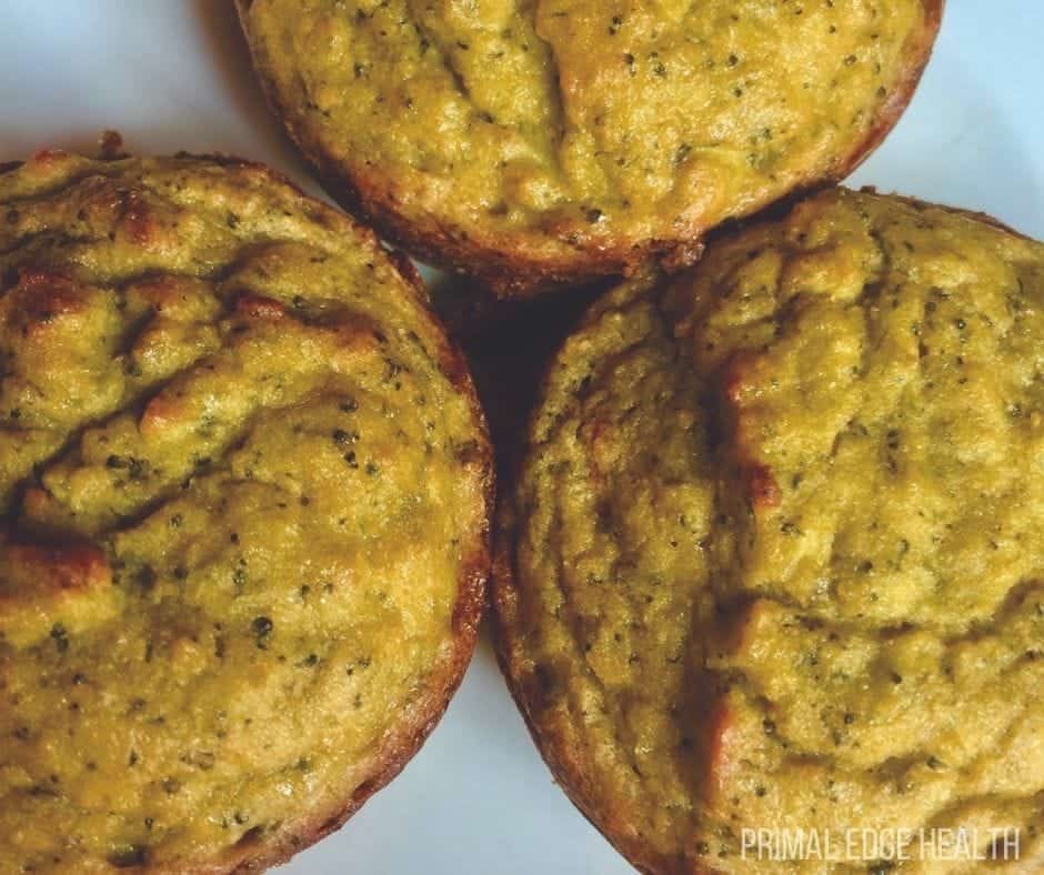 Tops of two savory muffins with hidden broccoli.