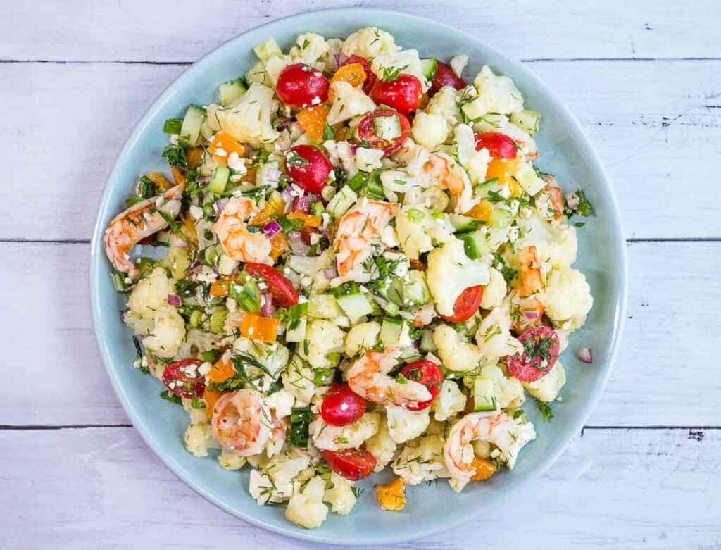 A closeup of Shrimp & Cauliflower Salad in a serving bowl.