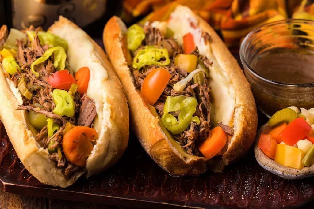 Two Italian beef buns on a tray.