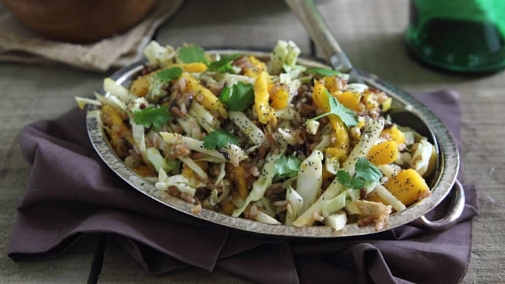 Mango wild rice salad in a silver platter.