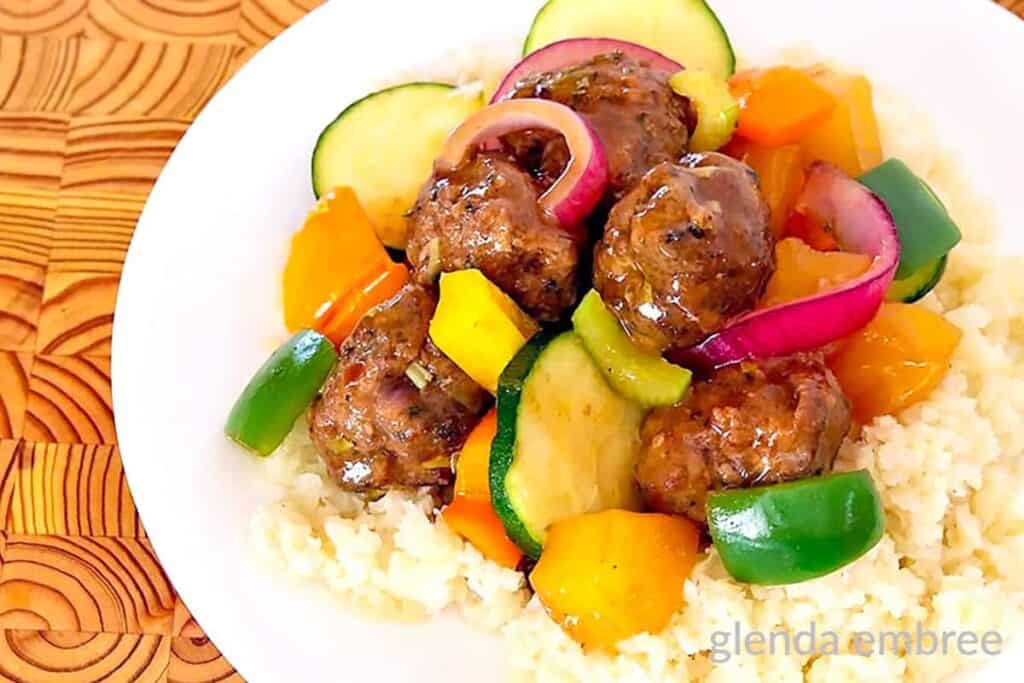 Sweet and Sour Meatballs with vegetables served over rice