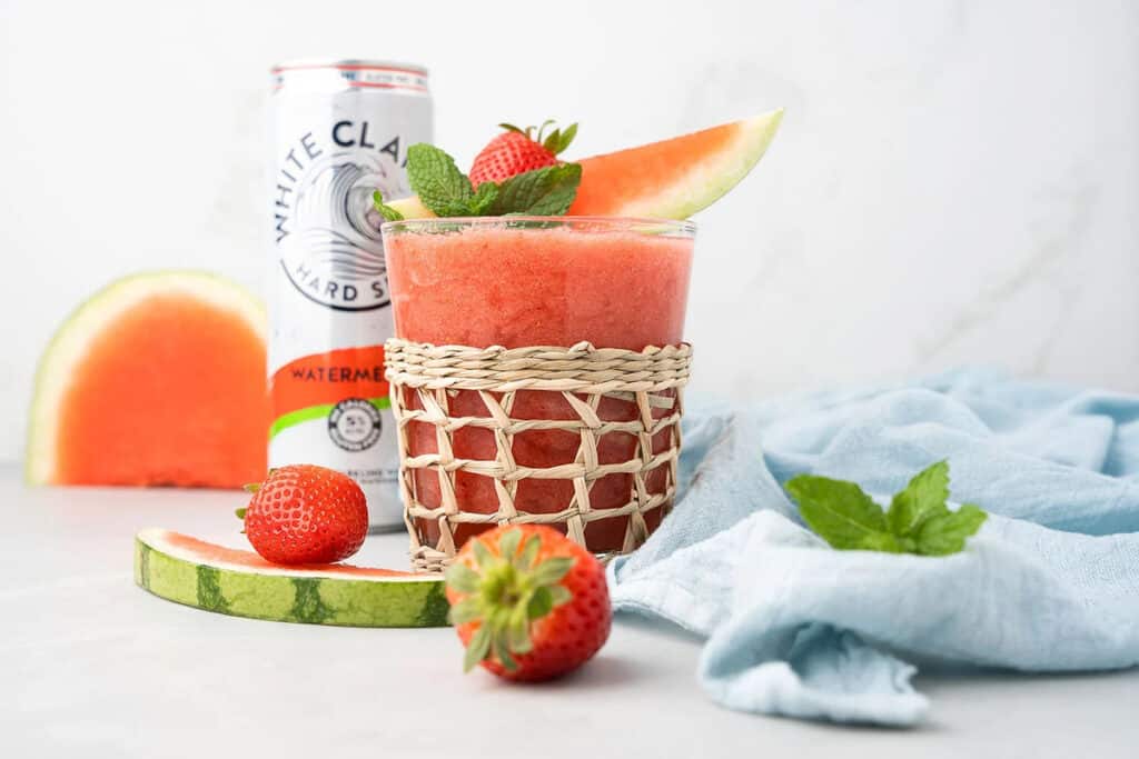 A strawberry watermelon slushie in a glass.