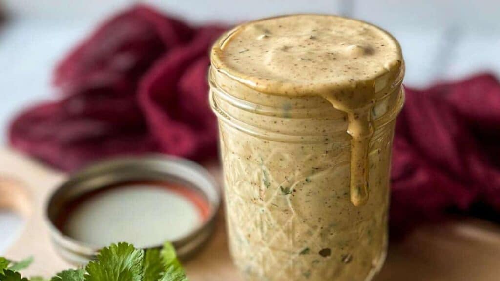 Chipotle southwest sauce in a glass jar.