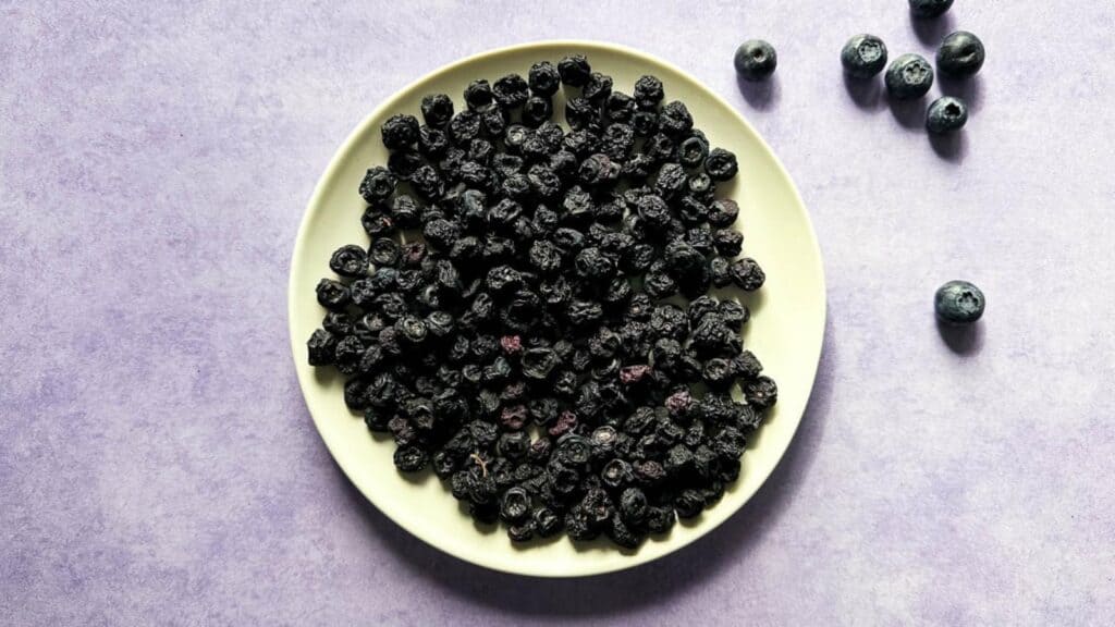Dehydrated Blueberries on a white plate.