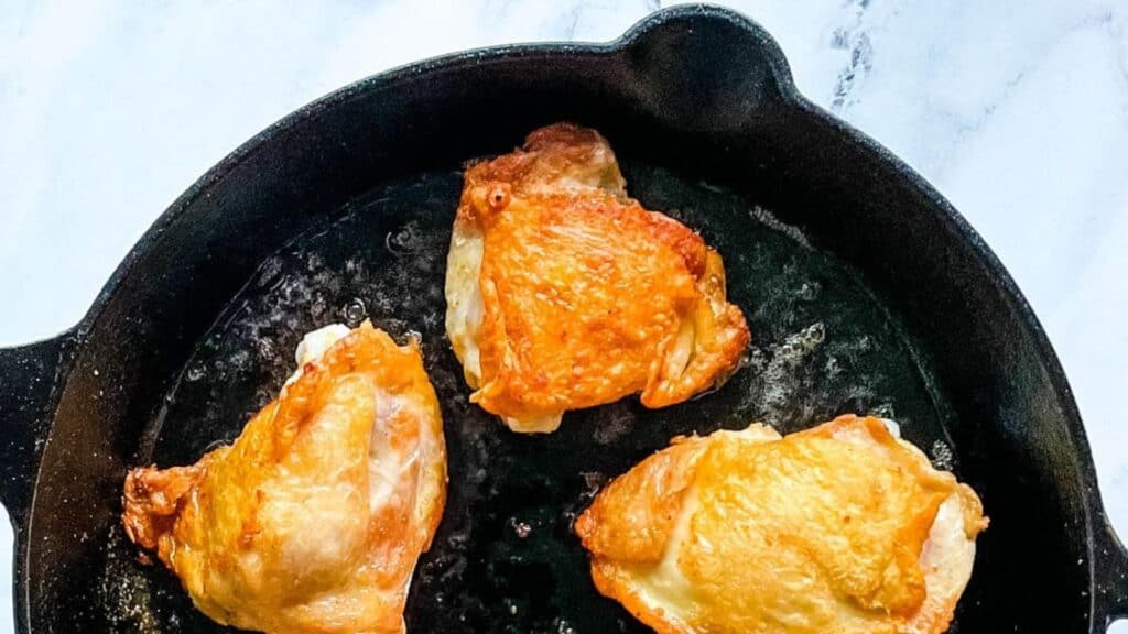 Cast Iron Chicken thighs in a cast iron skillet.