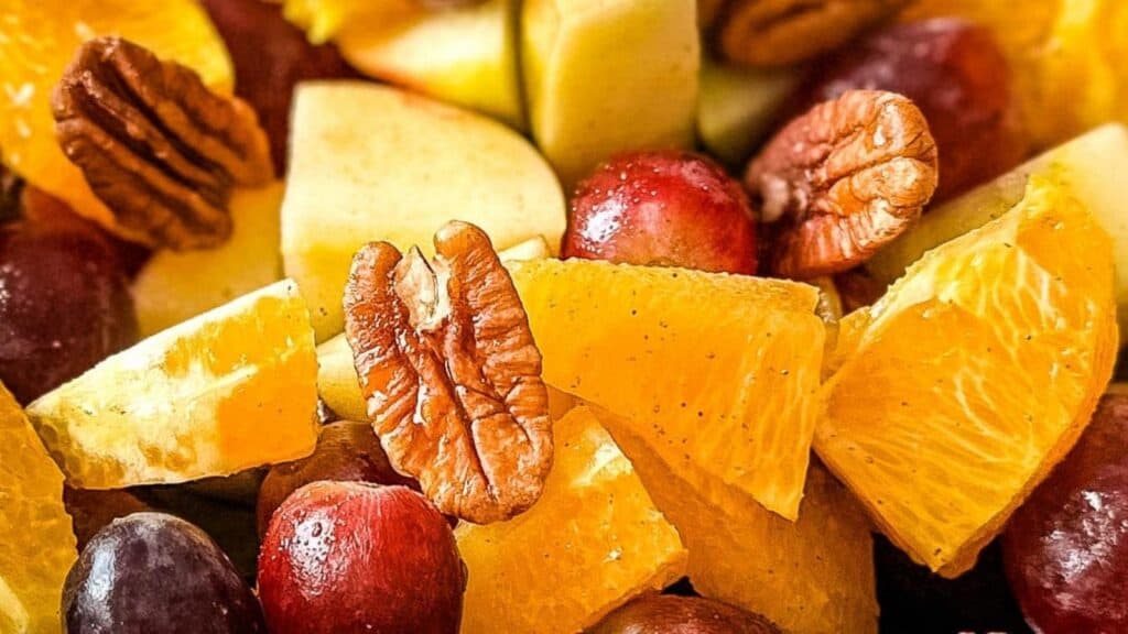 Closeup shot of fruit salad with walnuts.