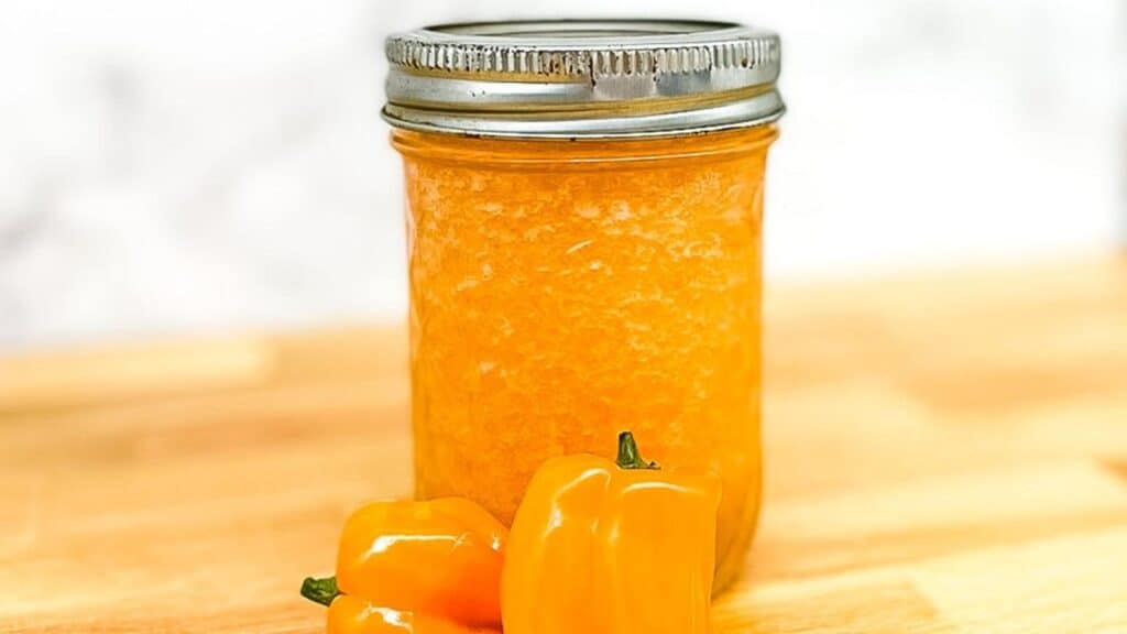 Pineapple habanero sauce in a glass jar.