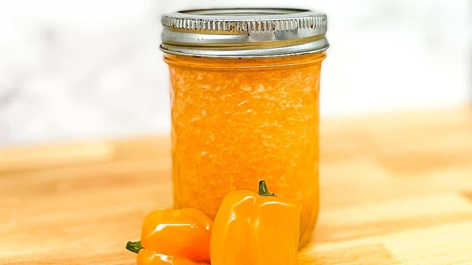 pineapple habanero sauce in a glass jar with a lid.