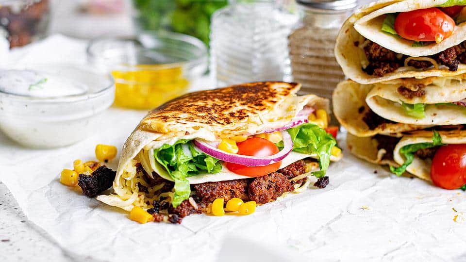 Beef tortilla folded wrap on a plate.