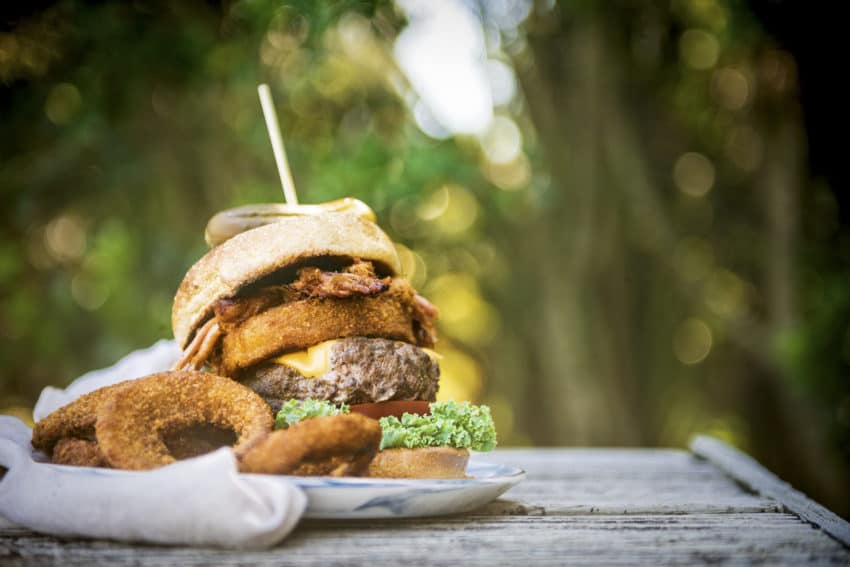 Burger on a picnic table. 