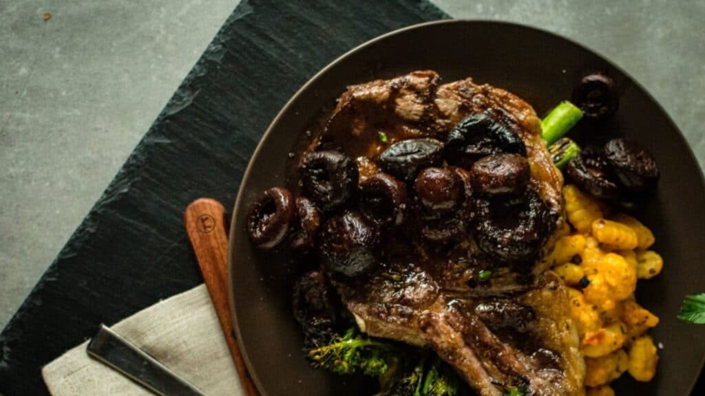 Steak with red wine sauce on top. 