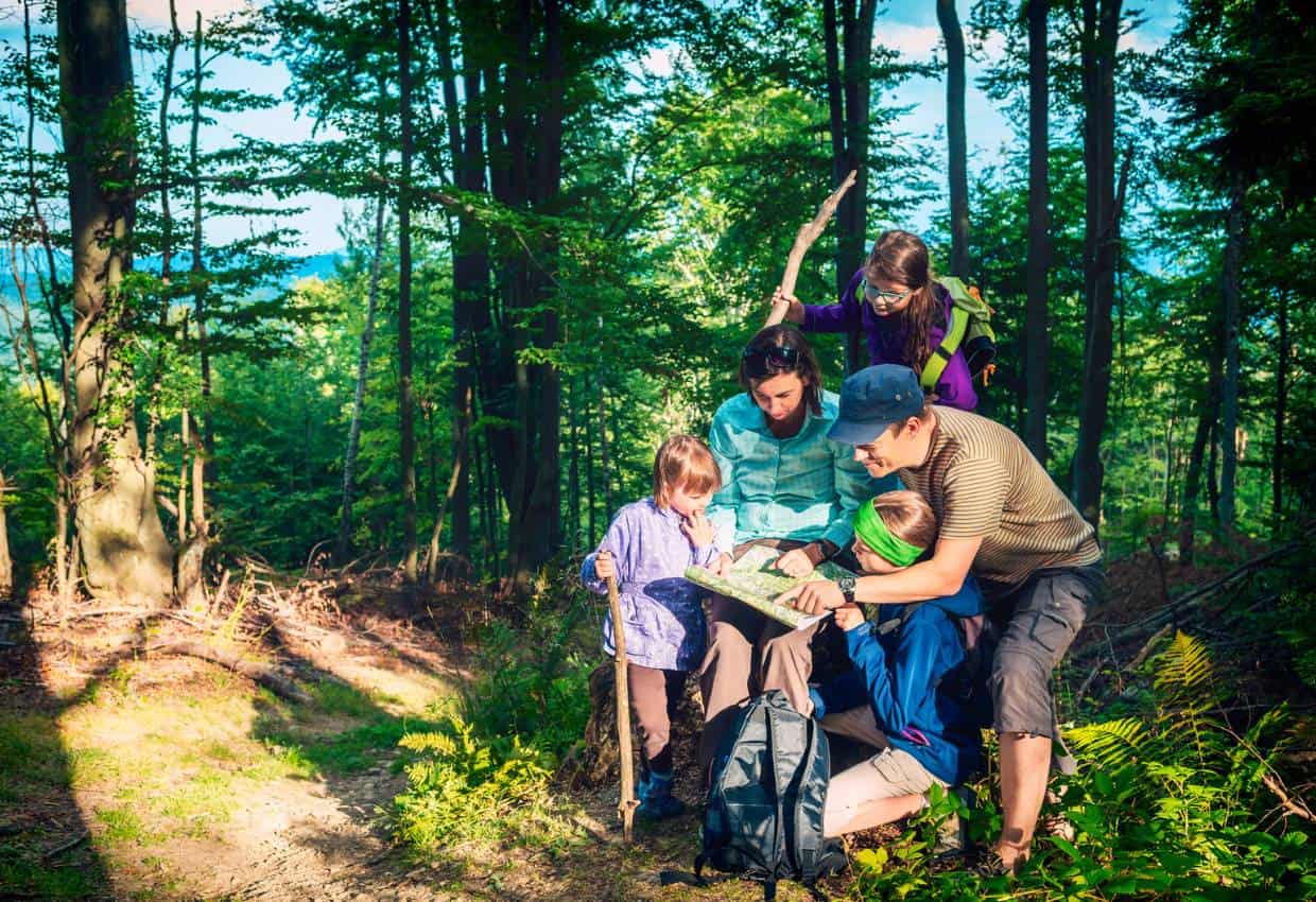 Family on a camping scavenger hunt.