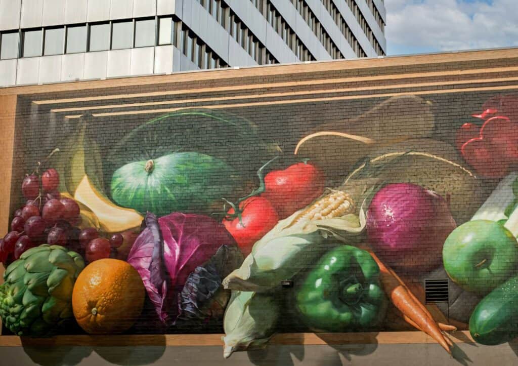 The Fresh Harvest mural in Cincinnati features a bounty of fresh fruits and vegetables.