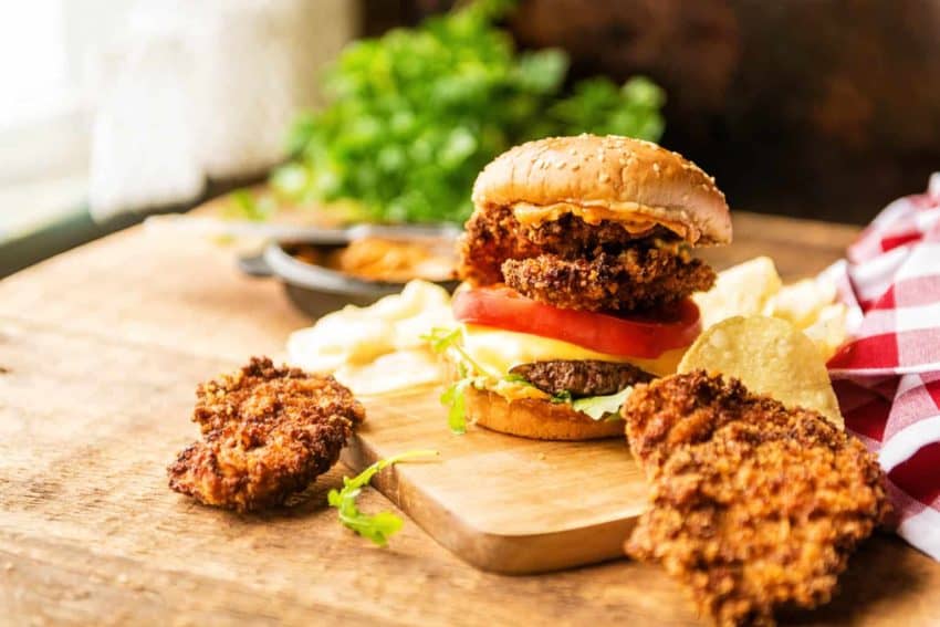 Fried oysters piled on top of a burger.