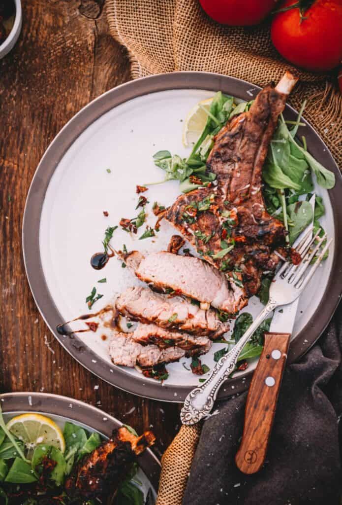 Grilled veal chop on a plate. 