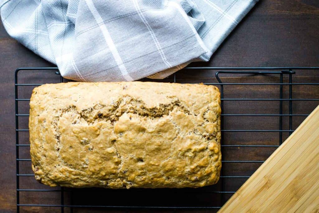 An overhead shot of a loaf of cheddar sausage Guinness beer bread.