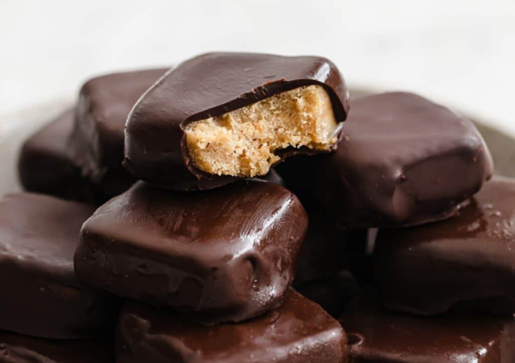 A stack of keto copycat Butterfinger bites.