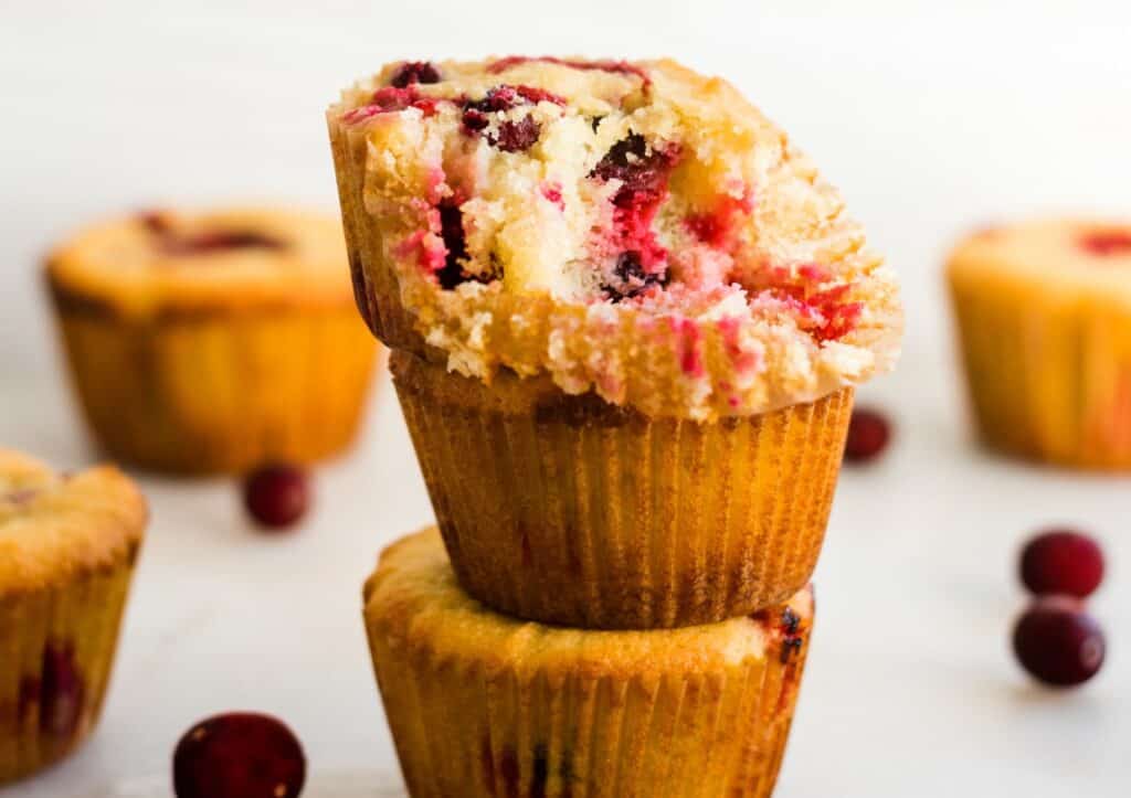 A stack of three low-carb cranberry orange muffins.