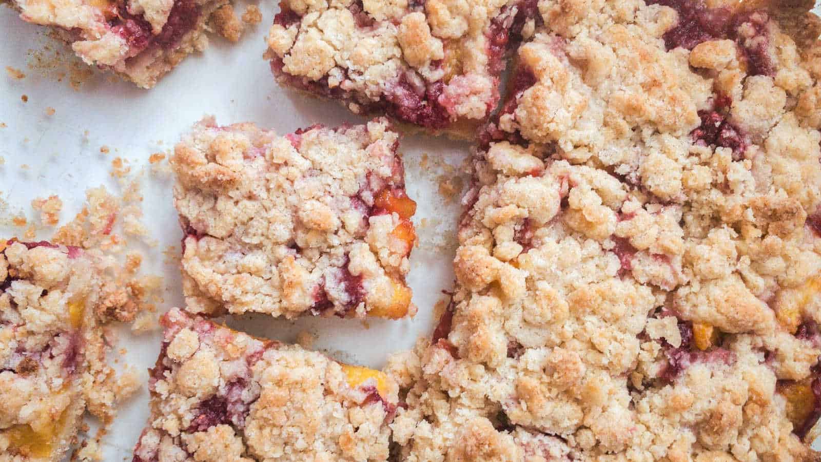 Peach raspberry bar cookies cut into squares.
