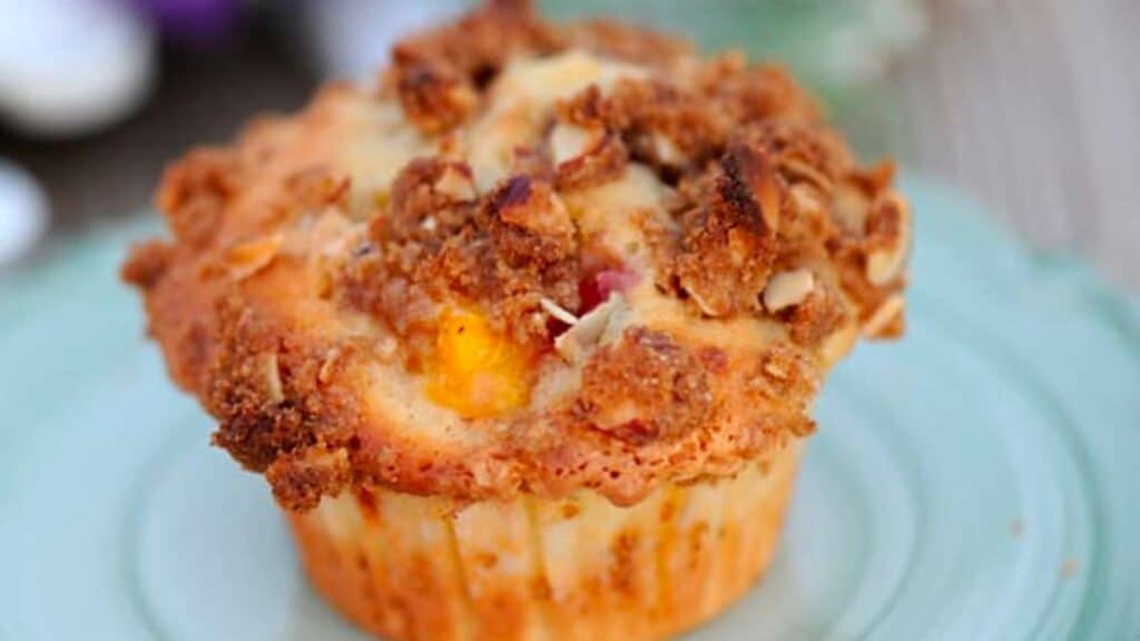peach muffin with almond crumble topping.