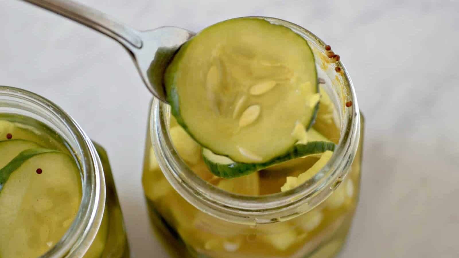 Top view of a jar of bread and butter pickles.